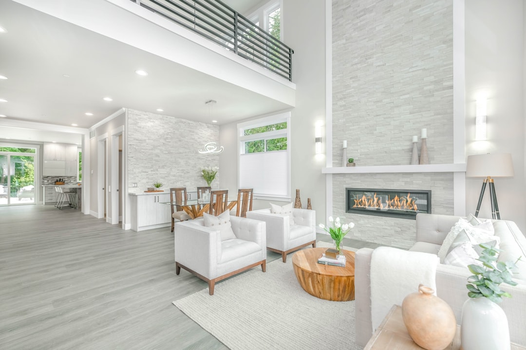 A happy family relaxing in the bright, modern living room of a professionally managed vacation rental, enjoying a safe and comfortable stay.