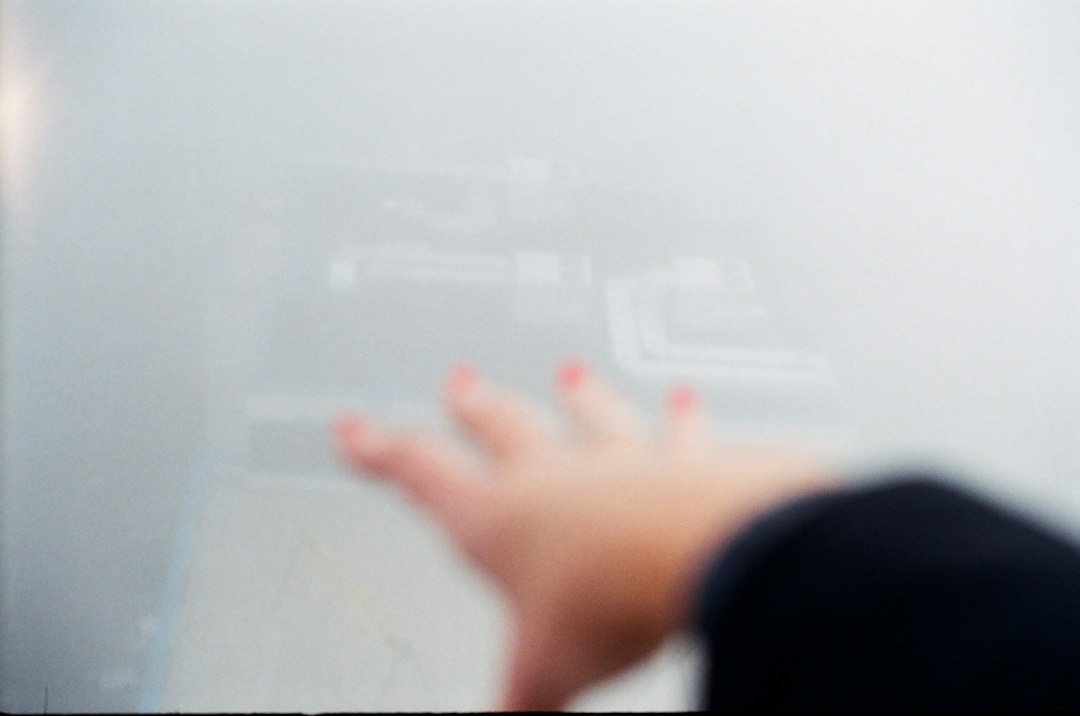 A professional in a modern setting interacting with a floating holographic data screen, symbolizing an innovator using post-Google AI strategies.
